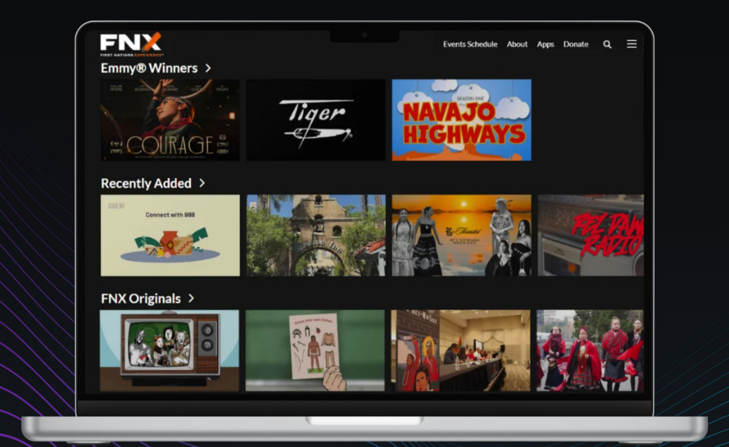 The FNX on-demand library on a laptop, with rows for Emmy winners, recently added programs, and FNX Originals