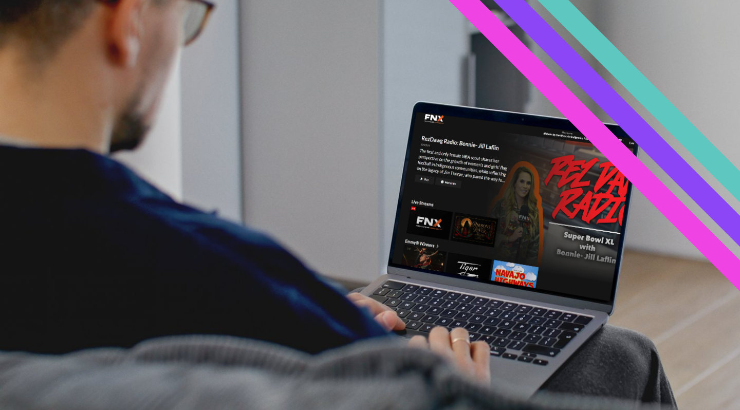 A viewer watching FNX programming on a laptop at home